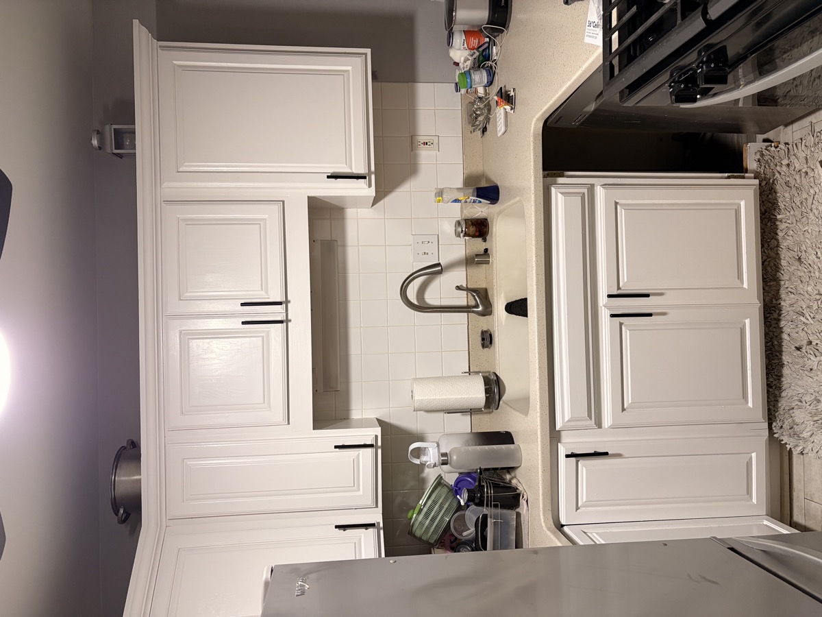 Kitchen after: cabinets refinished in white